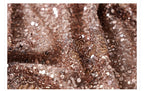 Close-up of camel midi skirt with geometric sequins showcasing shimmering details and texture