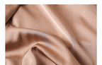 Soft fabric in camel color, perfect for a camel midi skirt with geometric sequins design