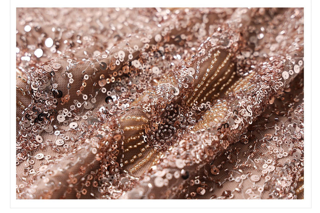 Close-up of camel midi skirt with geometric sequins showcasing its glamorous shimmer and detailed fabric texture