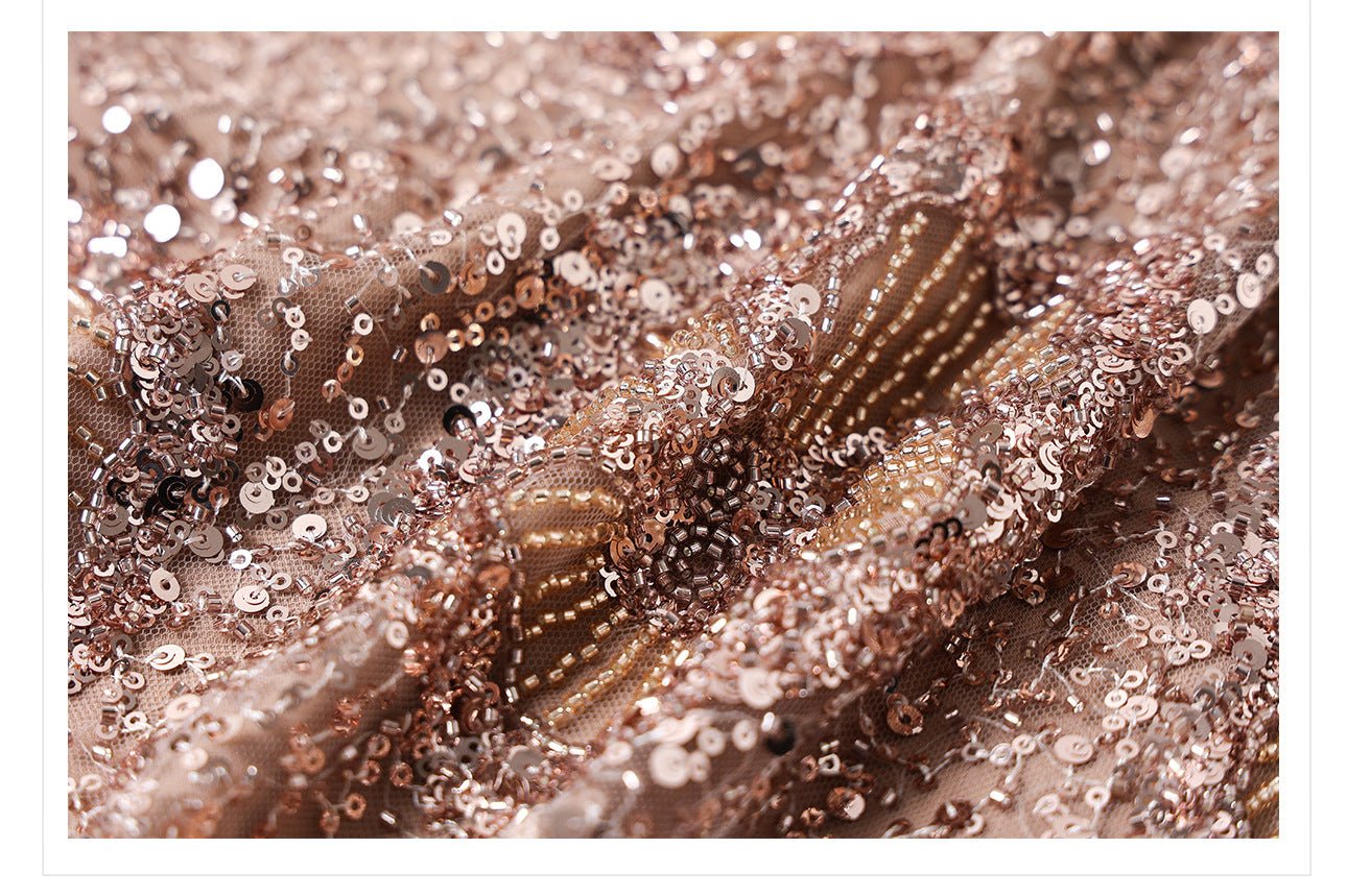 Close-up of camel midi skirt with geometric sequins showcasing its glamorous shimmer and detailed fabric texture