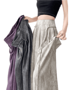 Model showcasing Casual Wide-Leg Pants in light and dark shades with stylish texture and fit