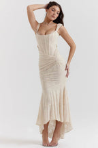 Elegant Mermaid Style Dress in beige with ruched detailing and a flared hem for a classy look