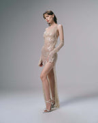 Elegant One-Shoulder Sequin Gown in nude with stylish long sleeves and a high slit for glamorous occasions