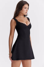 Elegant black short casual dress with scalloped straps and a fitted bodice for a chic look