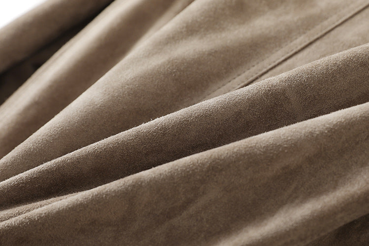 Close-up of the soft texture of a Vintage Belted Shearling Suede Jacket in warm tan color