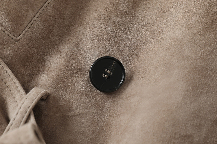 Close-up of a button on the Vintage Belted Shearling Suede Jacket showcasing its quality craftsmanship