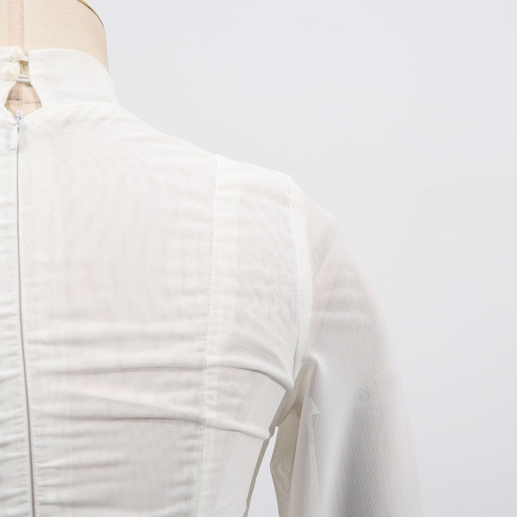 Close-up of a White Dress With 3D Flowers And Voluminous Skirt showcasing texture and design details