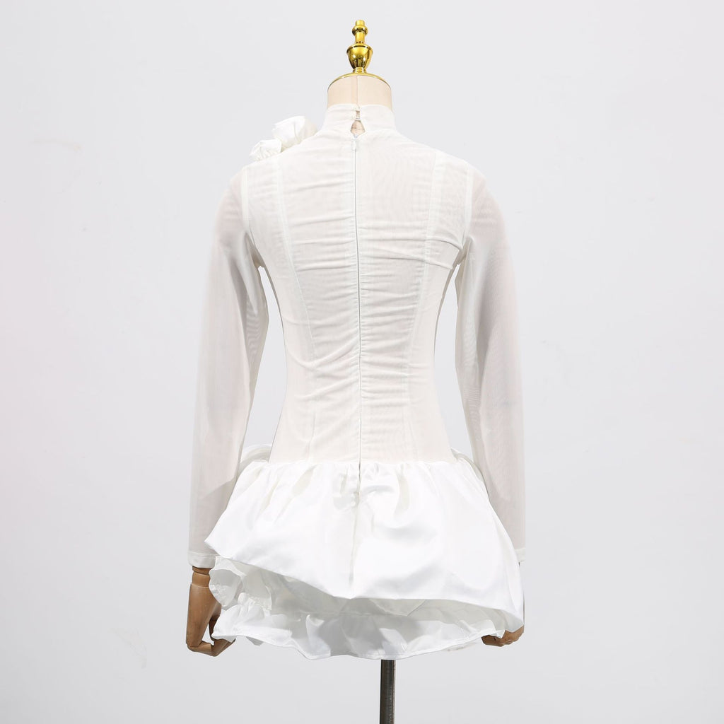 Back view of the White Dress With 3D Flowers And Voluminous Skirt, showcasing elegant details and design