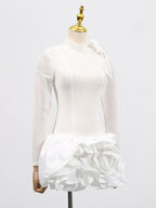 Stylish white dress with 3D flowers and voluminous skirt showcasing a chic design for special occasions