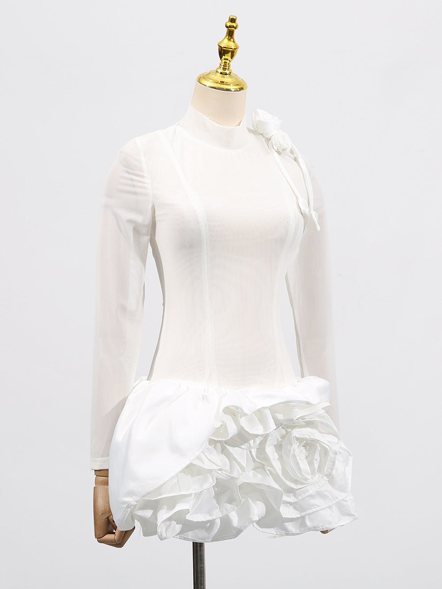 Stylish white dress with 3D flowers and voluminous skirt showcasing a chic design for special occasions