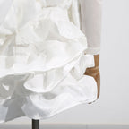 Elegant White Dress With 3D Flowers And Voluminous Skirt, showcasing layered ruffles and intricate floral details