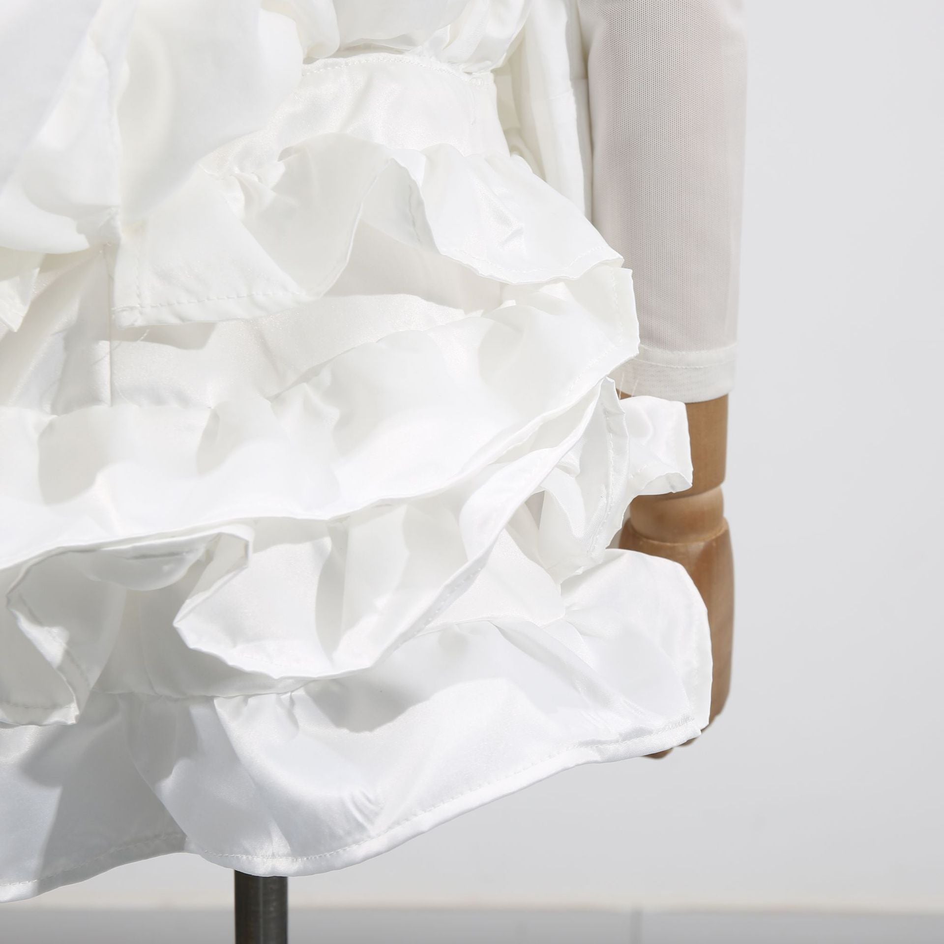 Elegant White Dress With 3D Flowers And Voluminous Skirt, showcasing layered ruffles and intricate floral details