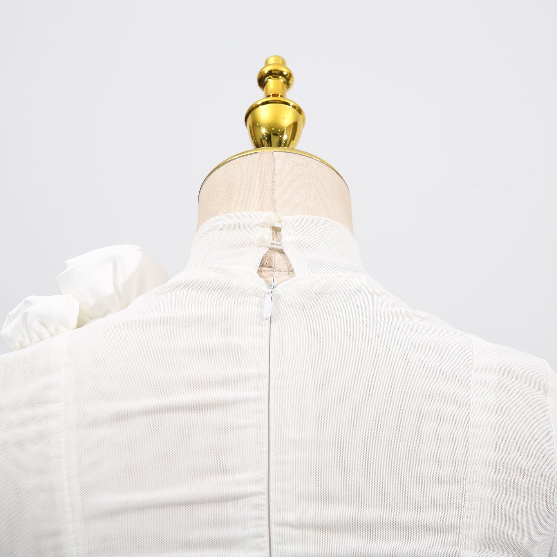 Back view of a White Dress With 3D Flowers And Voluminous Skirt showcasing intricate details and zipper closure
