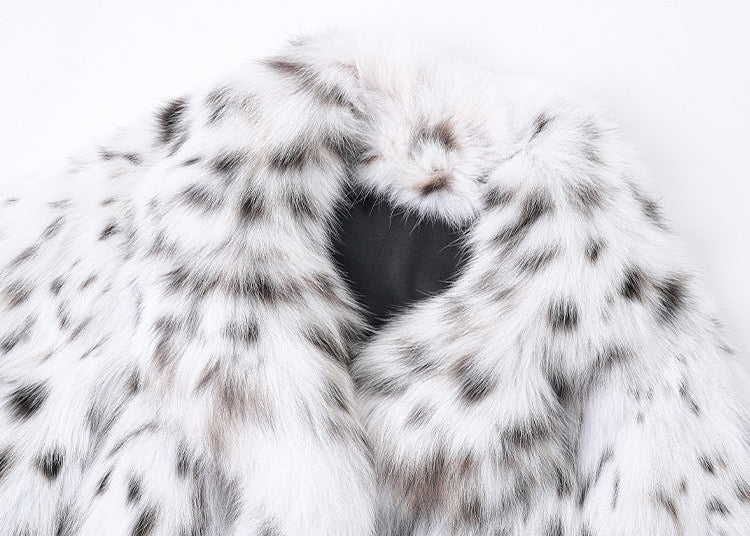 Close-up of the White Luxe Lynx Coat showcasing the soft fur texture and spotted design