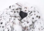 Close-up of the White Luxe Lynx Coat showcasing the soft fur texture and spotted design