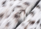 Soft texture of White Luxe Lynx Coat featuring elegant spotted pattern for winter fashion