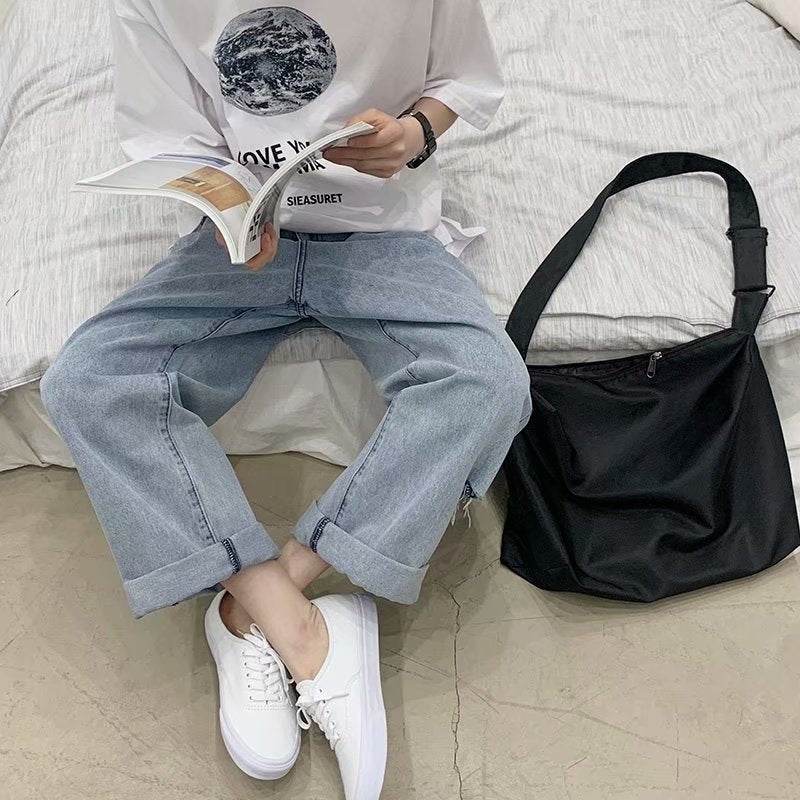 Casual outfit featuring Wide Jeans with Folded Hem and Rips, styled with a graphic tee and sneakers