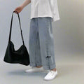 AM Vision RO Wide Jeans with Folded Hem and Rips styled with a casual white tee and sneakers