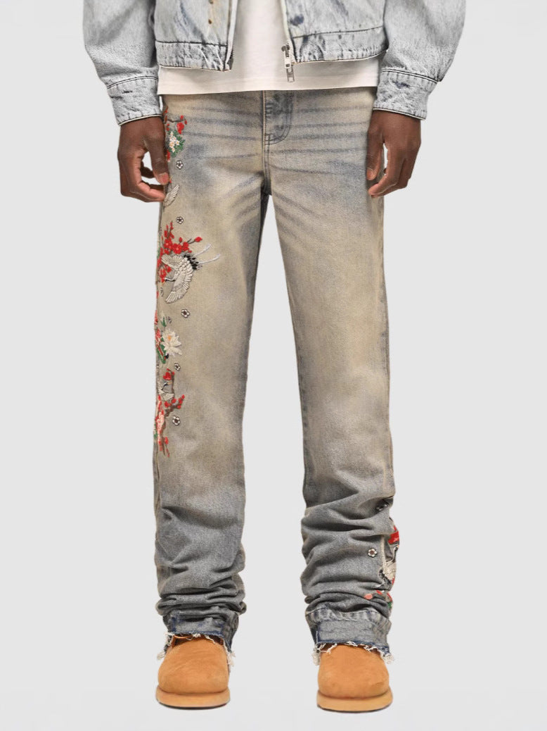 Wildflight Embroidered Jeans featuring colorful floral designs on a light wash denim