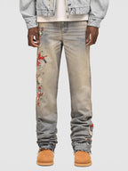 Wildflight Embroidered Jeans featuring colorful floral designs on a light wash denim