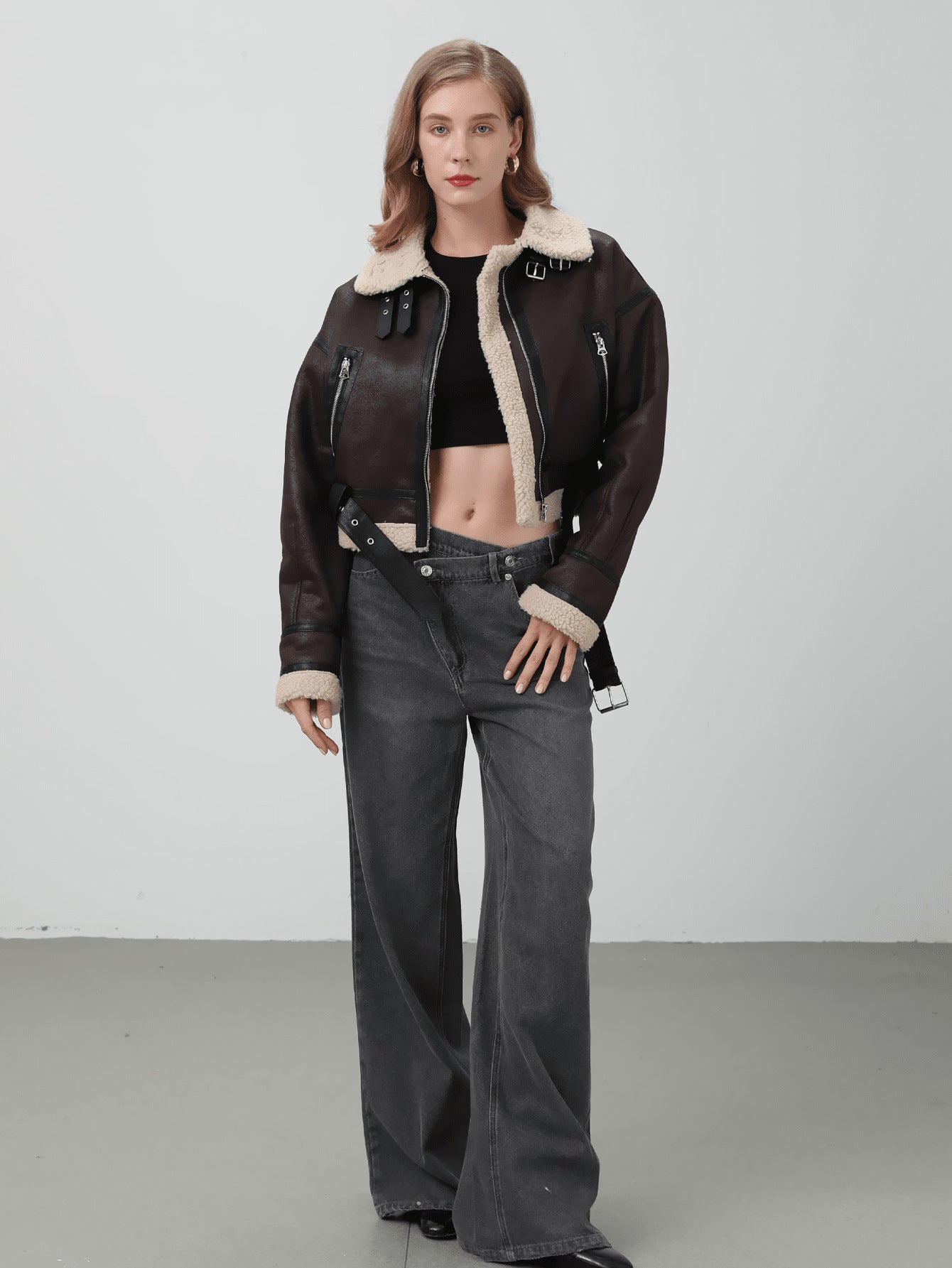 Women Retro Motorcycle Style Short Fur Jacket with a stylish black crop top and gray wide-leg pants