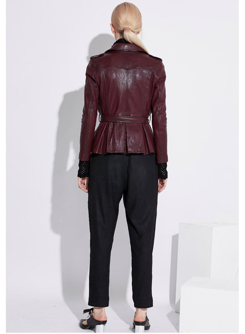Back view of women's wine leather moto jacket with peplum design and stylish detailing