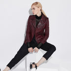 Fashionable women's wine leather moto jacket styled with a black outfit for a chic look