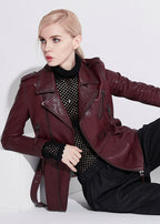 Stylish women's wine leather moto jacket with zippered pockets and a chic design