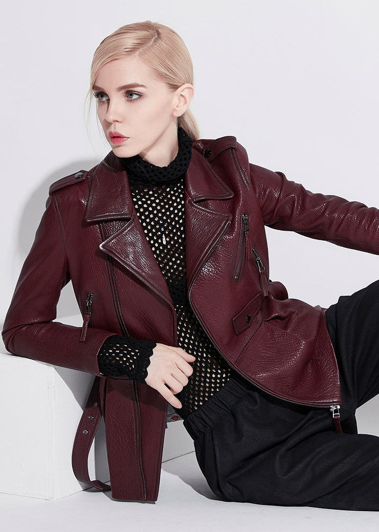 Stylish women's wine leather moto jacket with zippered pockets and a chic design