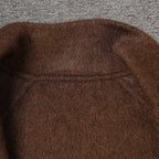 Close-up of a brown AM Vision RO wool jacket showcasing its soft texture and stitching details