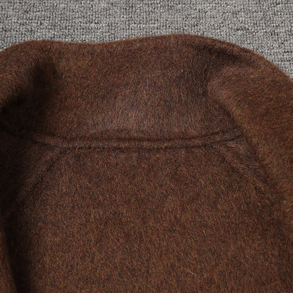 Close-up of a brown AM Vision RO wool jacket showcasing its soft texture and stitching details