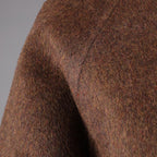 Close-up of a warm AM Vision RO wool jacket featuring a rich, textured fabric for comfort and style